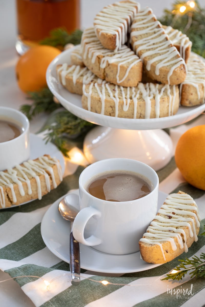 Bourbon Orange Biscotti on a small cake stand with coffee cup.