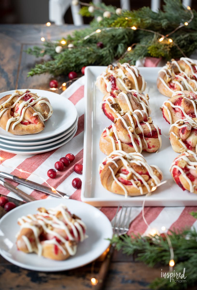 Cranberry Sweet Rolls christmas breakfasts on a platter and plates.