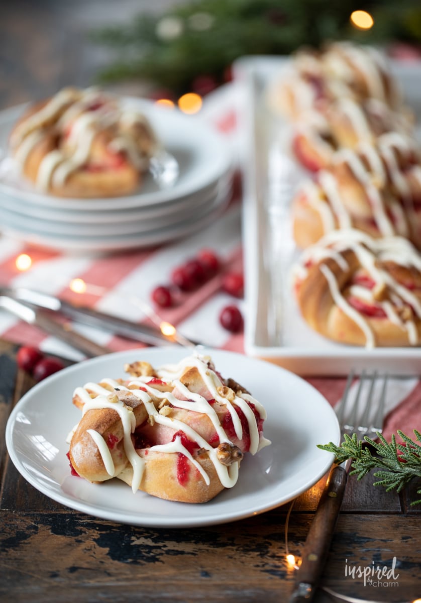 Cranberry Sweet Rolls on a platter and plates.