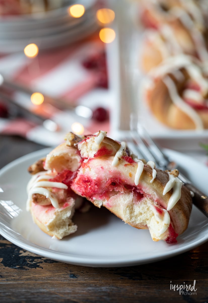 cut open Cranberry Sweet Roll on a plate.
