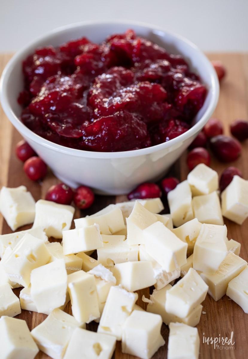 cubed brie and cranberry sauce in a bowl. 