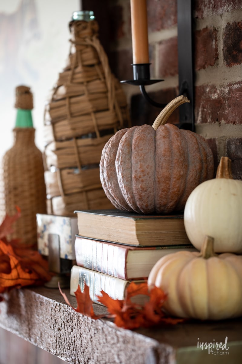 close up of pumpkins on fall mantel.