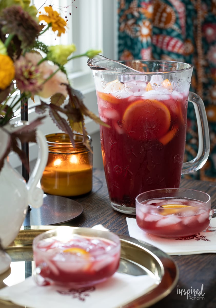 Pomegranate Rum Punch in glasses and pitcher. 
