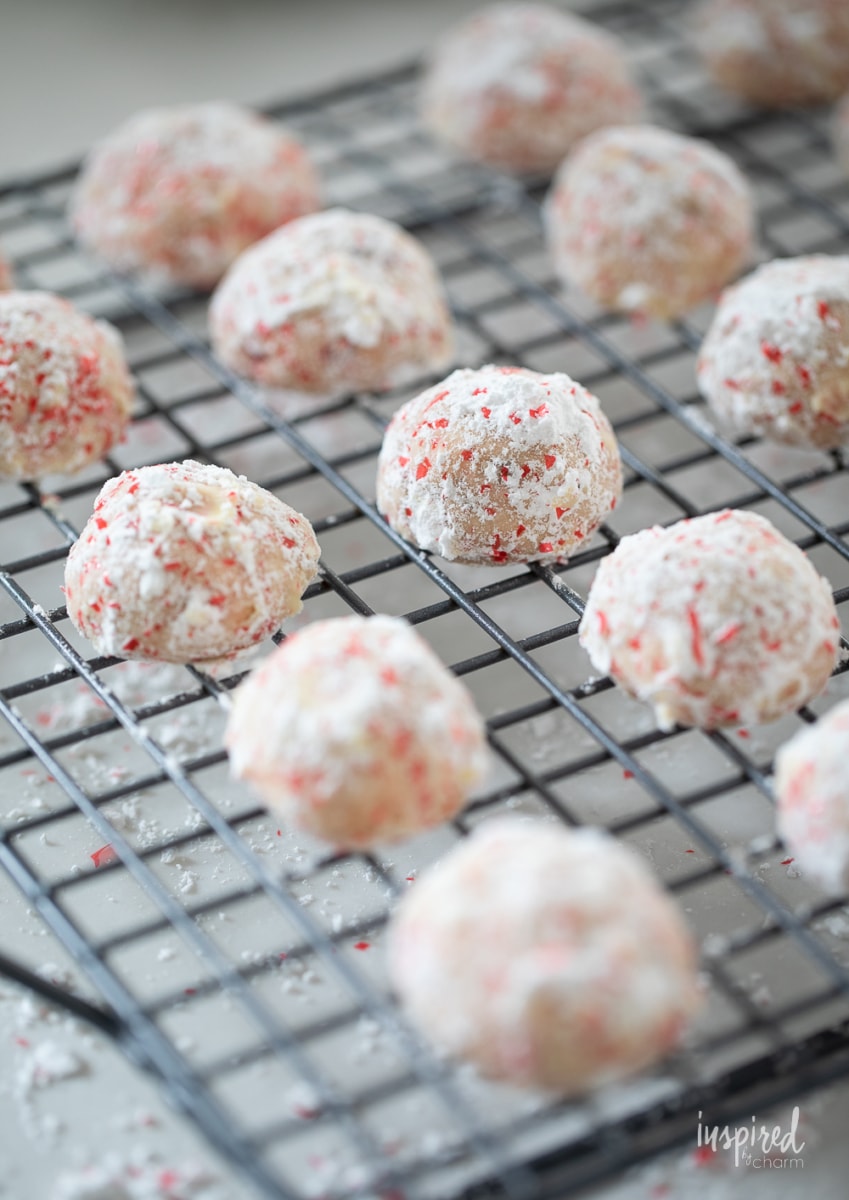 Cherry Walnut Snowball Cookies on a cooling rack.