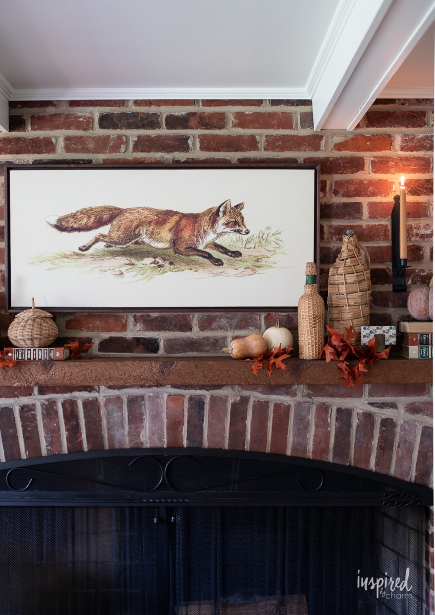 fox painting above a mantel. 
