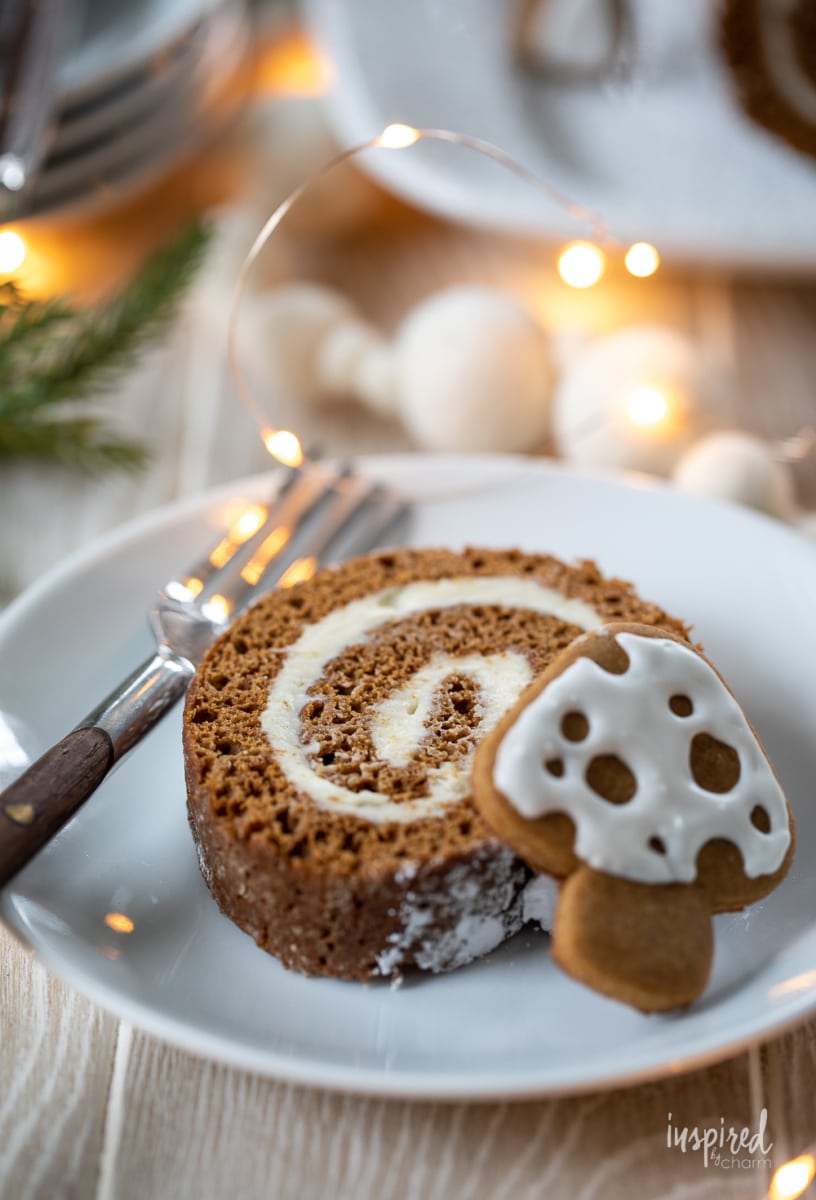 Gingerbread Swiss Cake Roll slice on a plate.