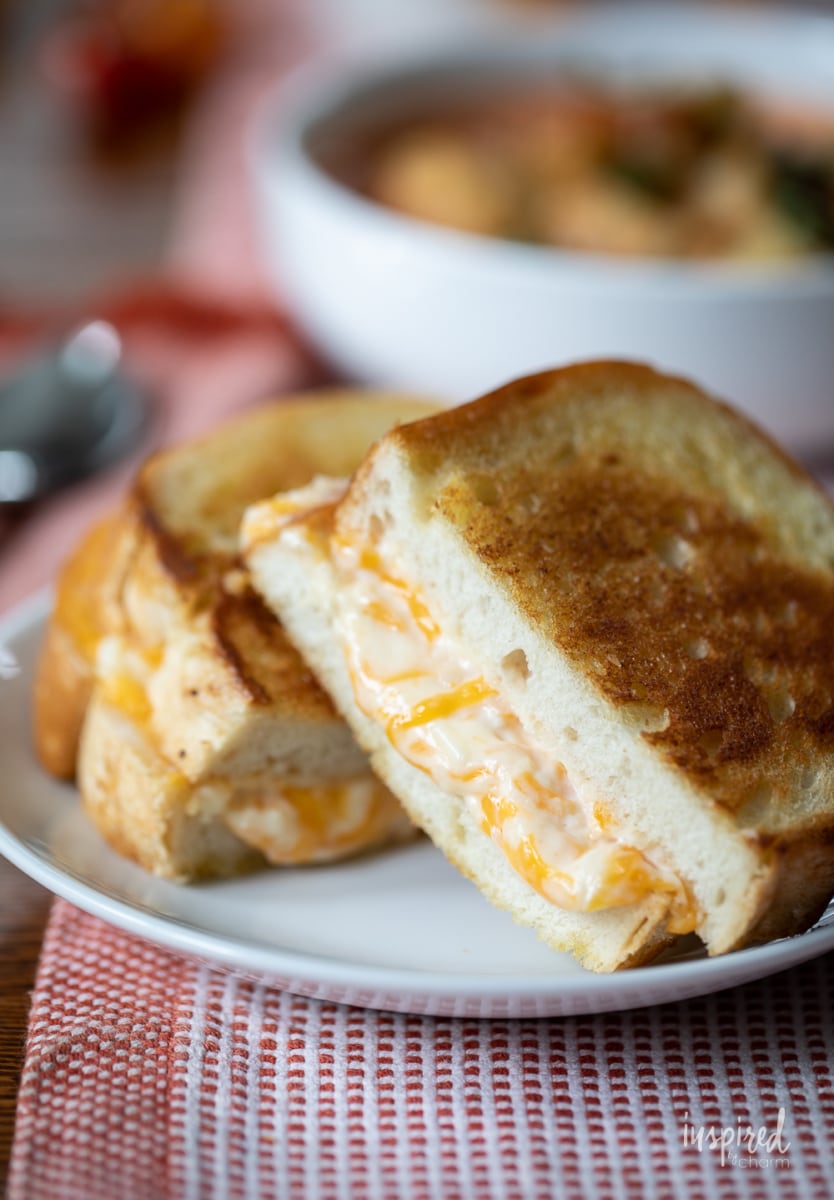 Ultimate Grilled Cheese cut on a plate.