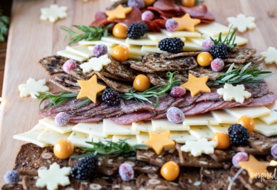 Christmas Cheese Board shared like a tree on a table.