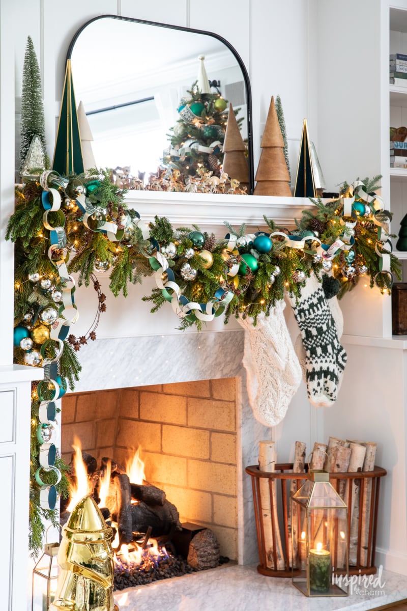 christmas mantel and fireplace decor with garland.