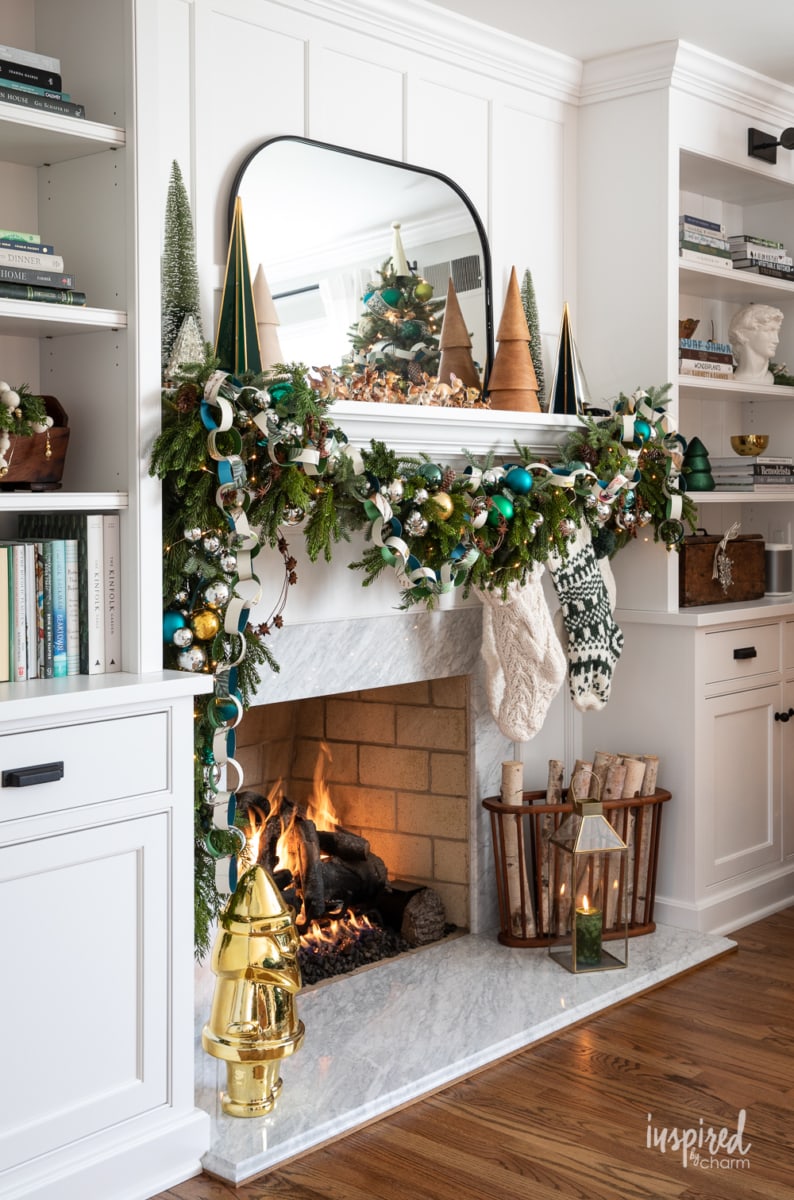 christmas mantel decor with fireplace and candles.
