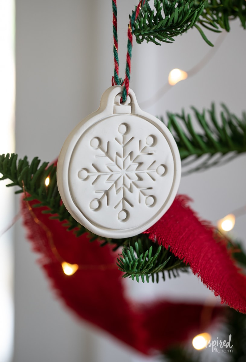 clay ornament hanging on a tree.