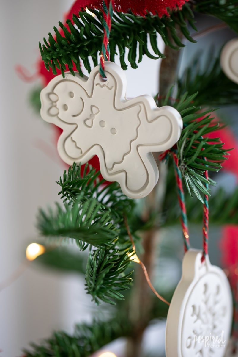 clay gingerbread man christmas ornament on a tree.