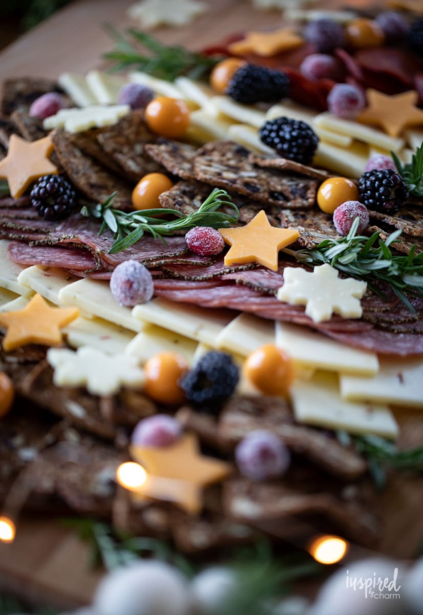 close up of Christmas Cheese Board  shared like a tree on a table. 
