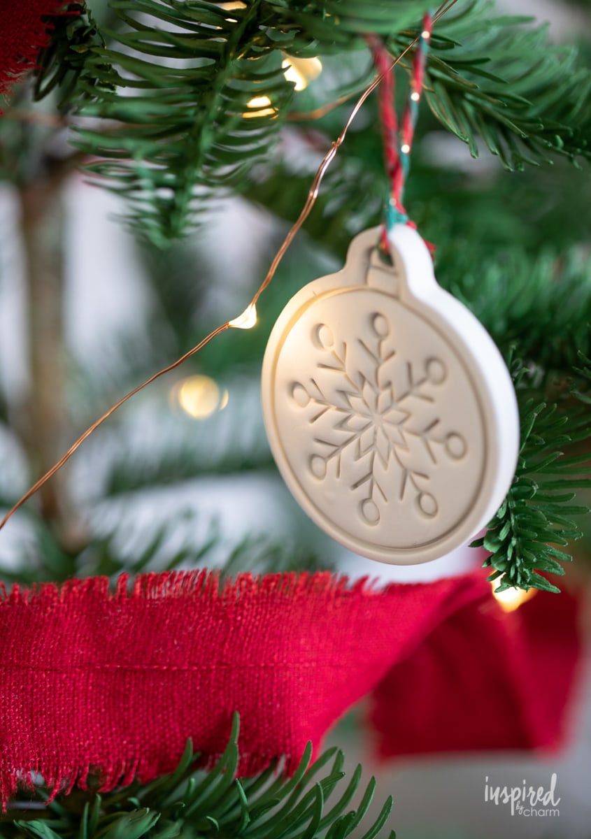 clay christmas ornament hanging on tree.