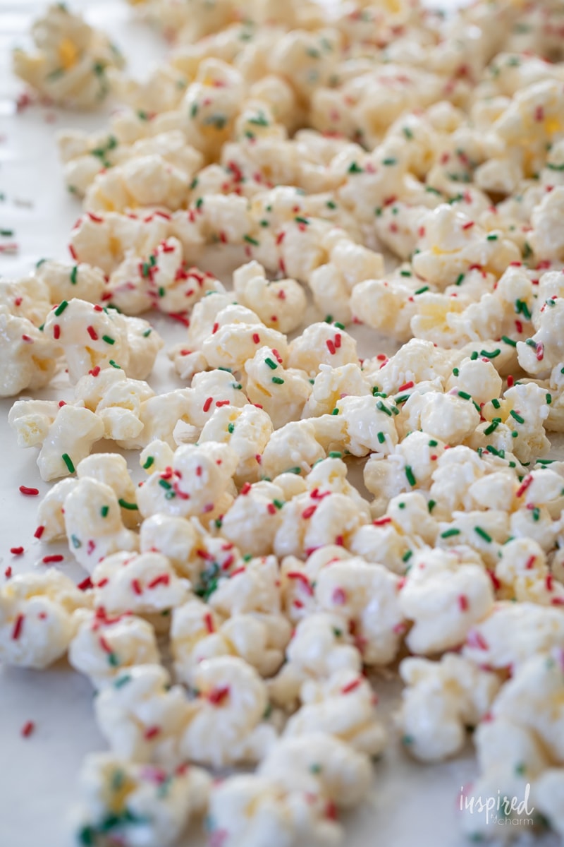 White Chocolate Puff Corn with sprinkles  on wax paper.