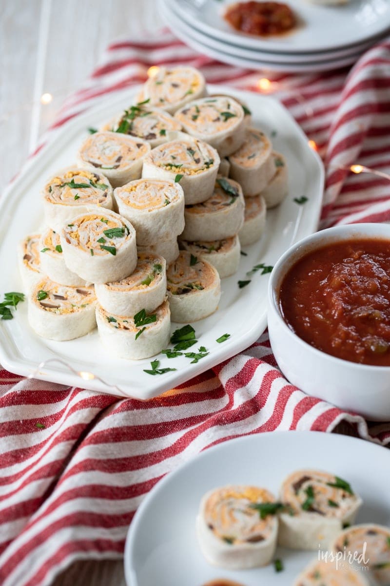 taco pinwheels with salsa on the side.