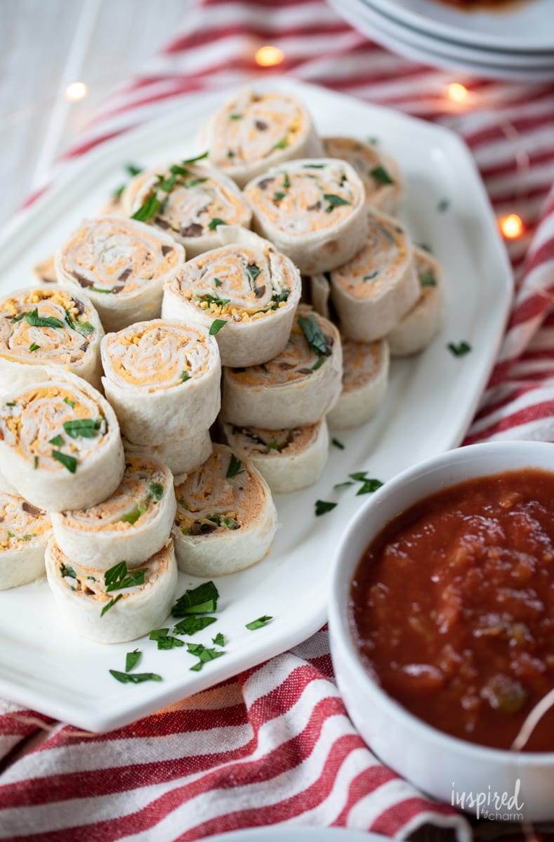taco pinwheels with salsa on the side. 