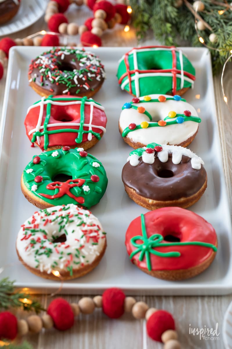 colorful christmas donuts on a platter.