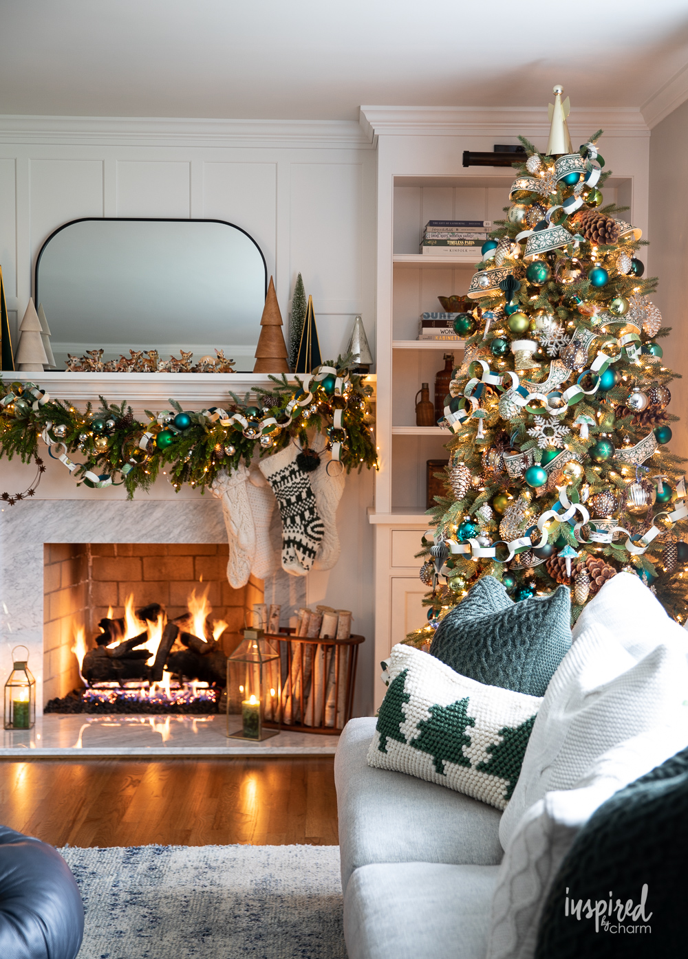 christmas tree with fireplace in background.