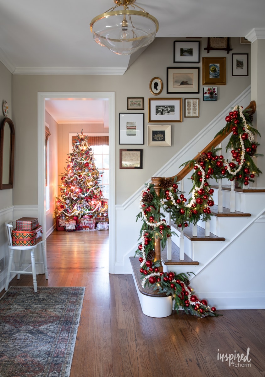 decorated foyer with christmas tree in the background.