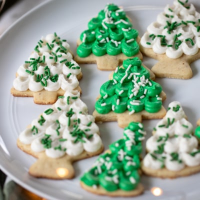 tree shaped Frosted Almond Sugar Cookies on a plate,