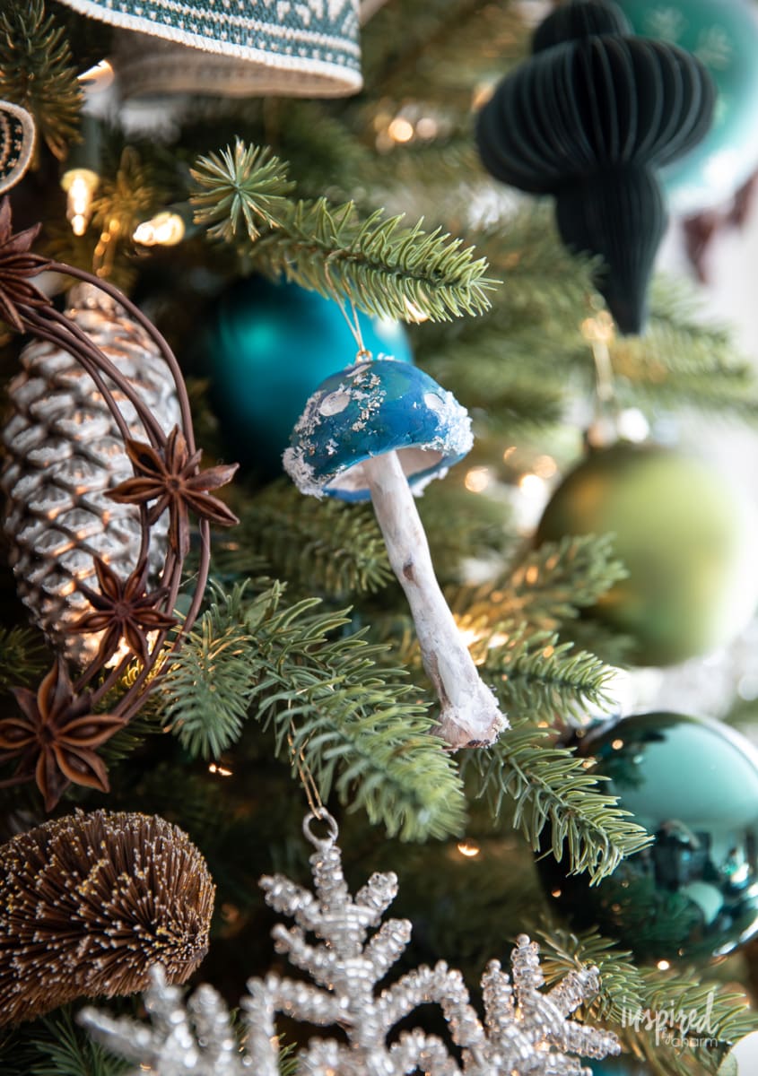 DIY Clay Mushroom Ornaments for Christmas on a tree.