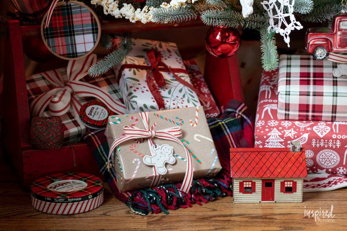 presents under a christmas tree in red colors.