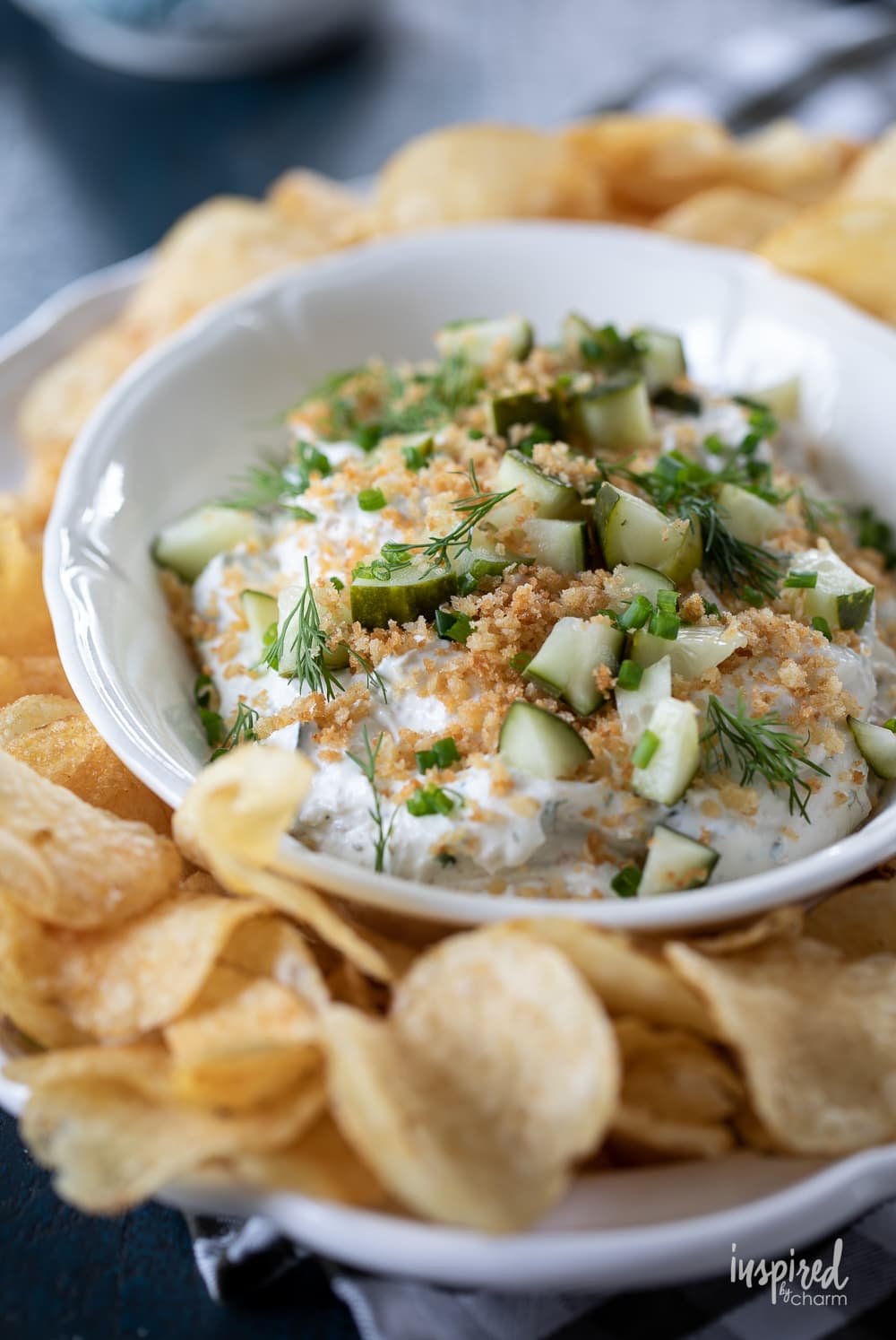 fried pickle and ranch dip in a bowl with potato chips.