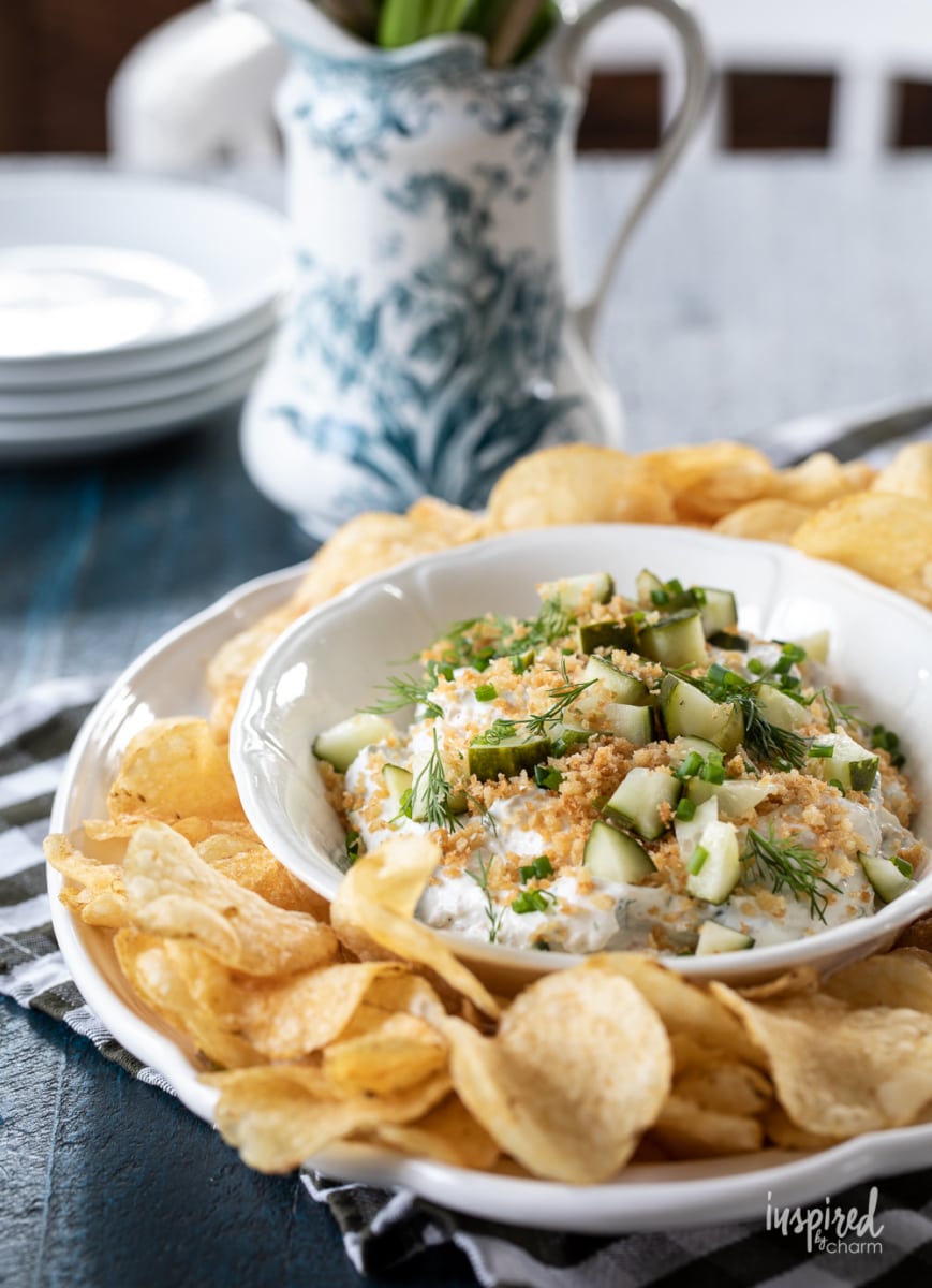 fried pickle and ranch dip in a bowl with potato chips.