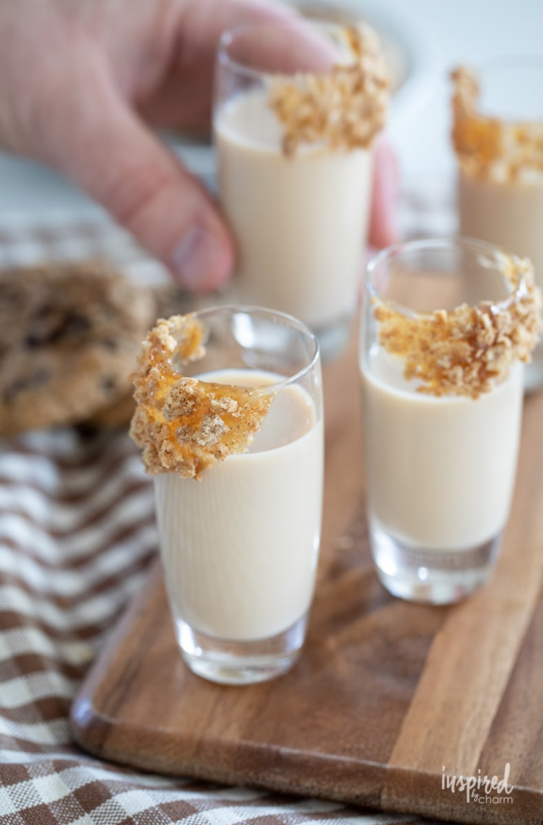 hand holding oatmeal cookie shot. 