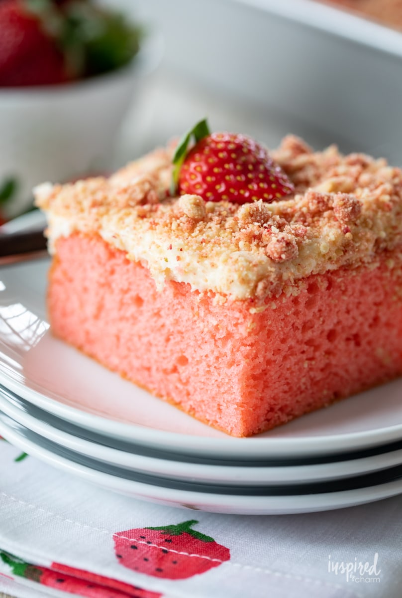 slice of strawberry crunch cake on a plate.