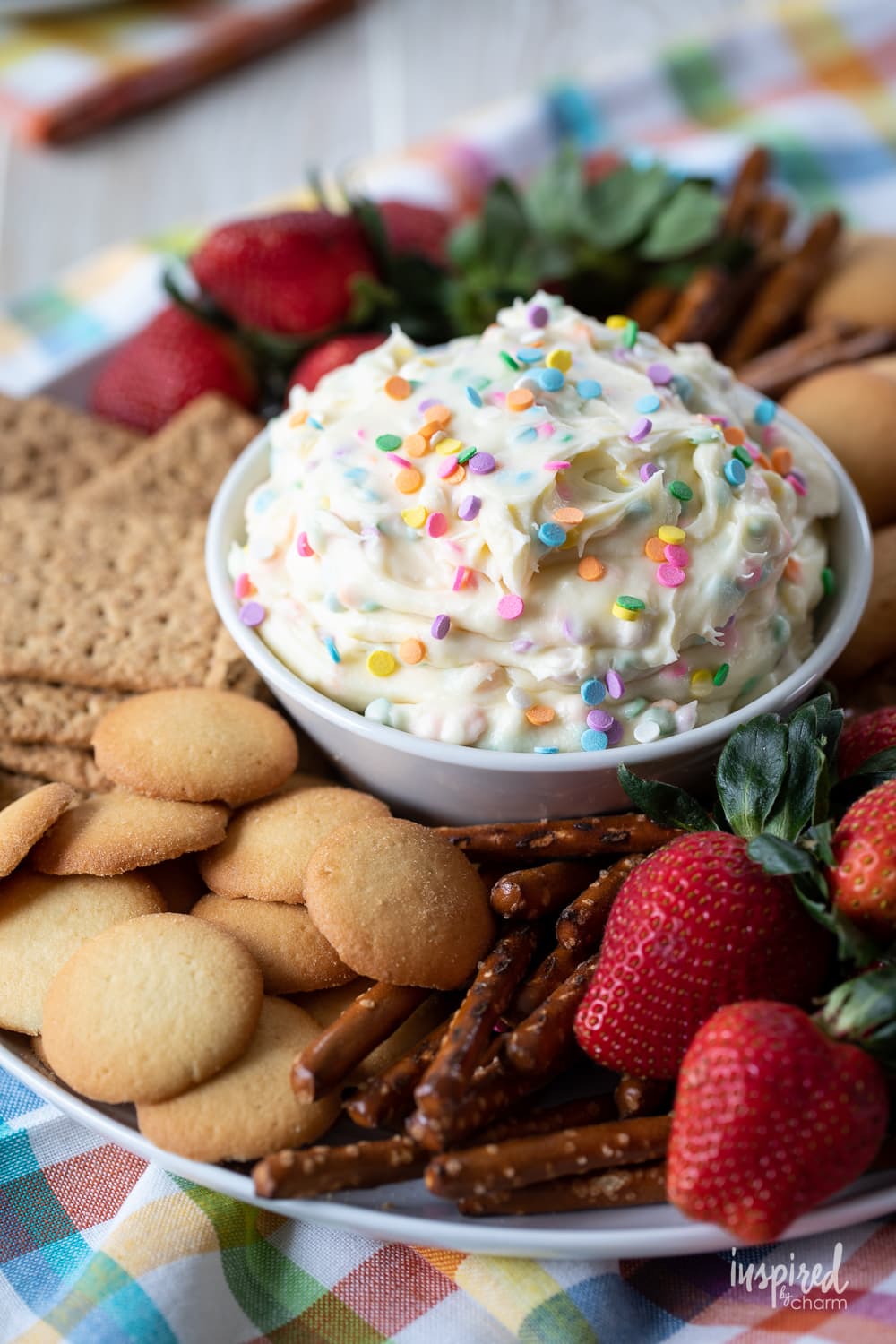 funfetti dessert dip in a bowl with sprinkles.