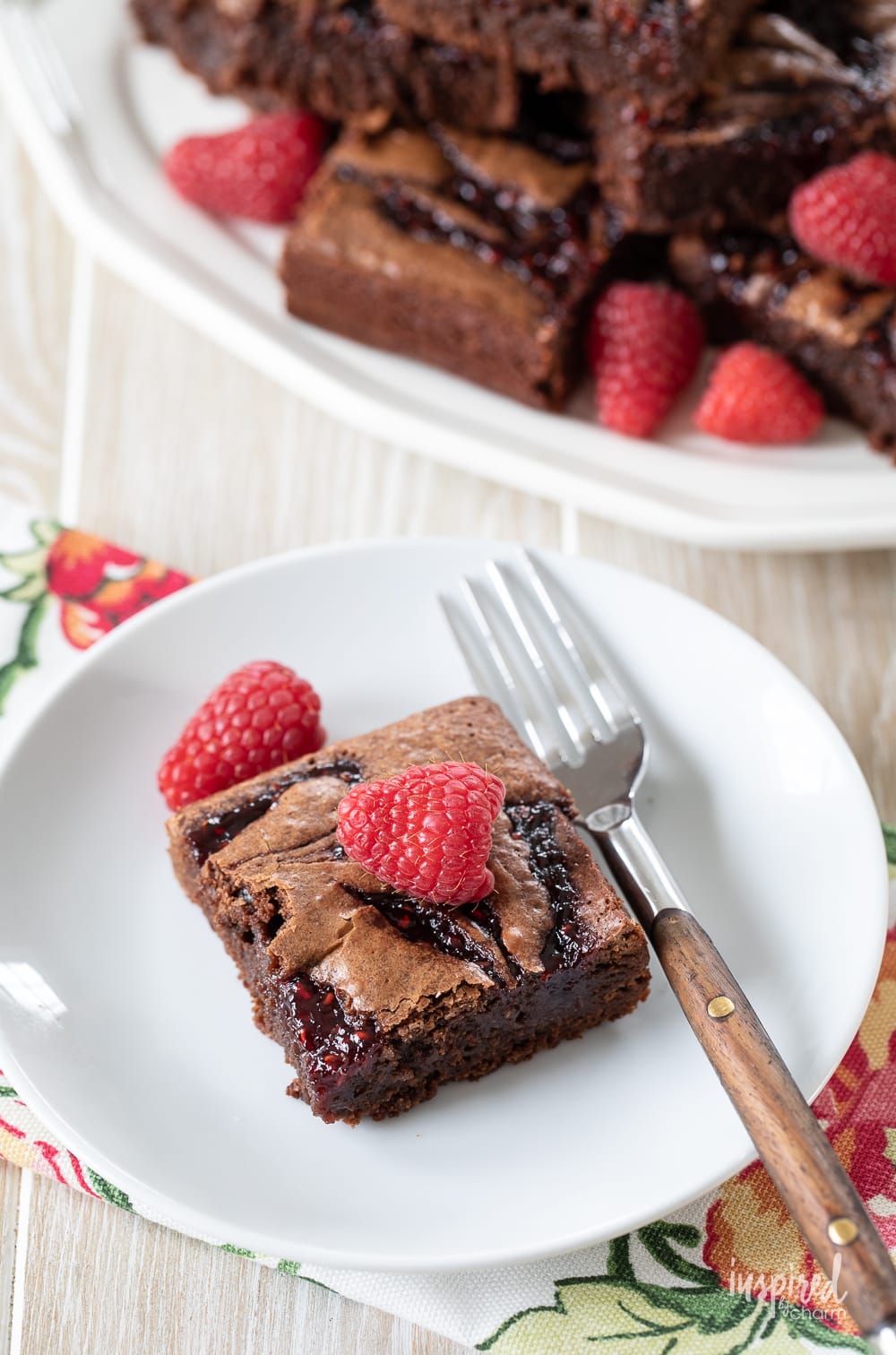 Raspberry Brownie on a plate with fork.