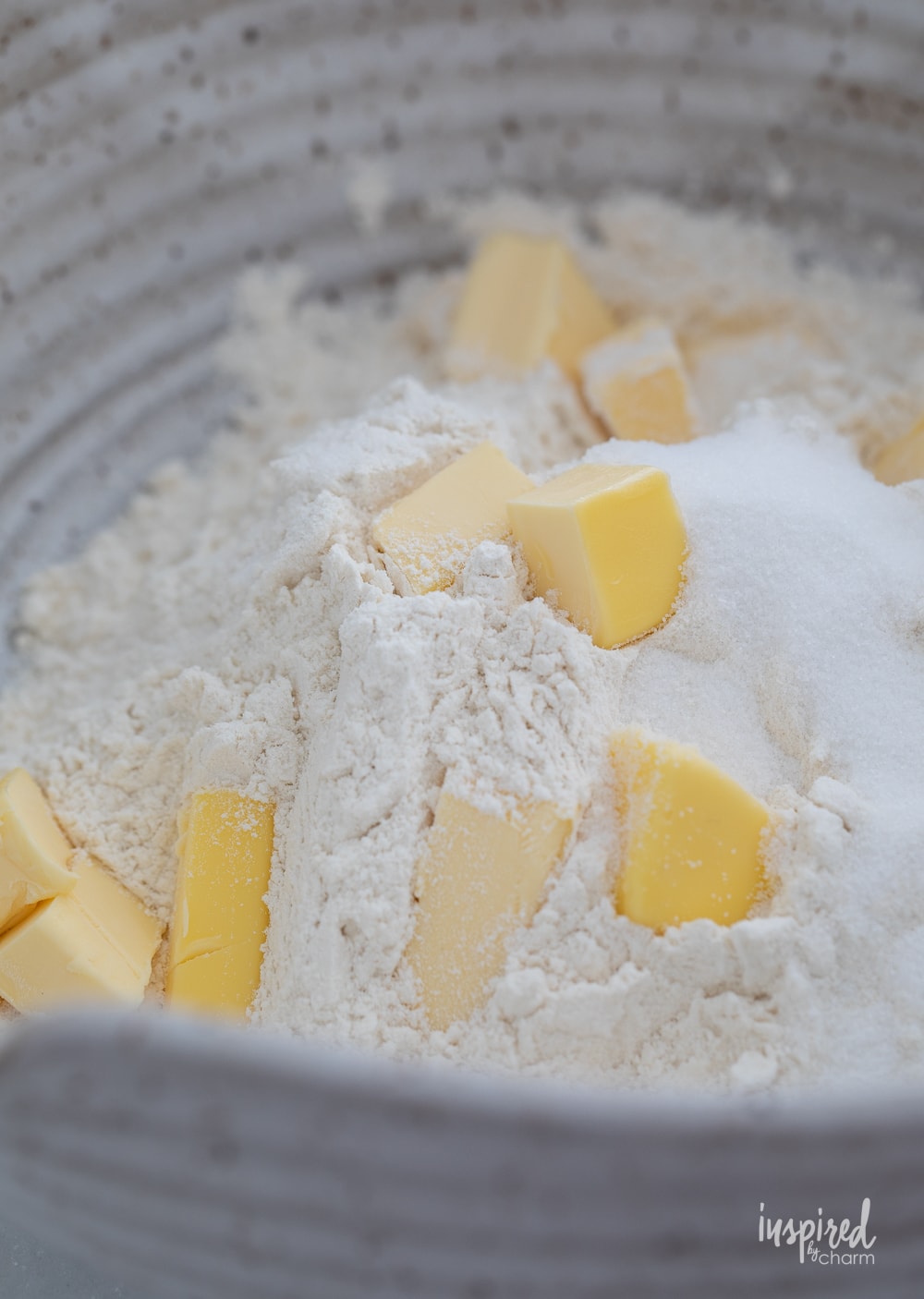 flour and cubes of butter in a bowl.