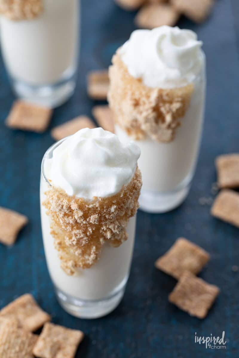 a group of Cinnamon Toast Crunch Shots surrounded by cereal.