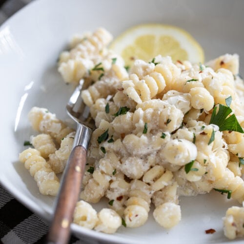 lemon ricotta pasta in a bowl with a fork.