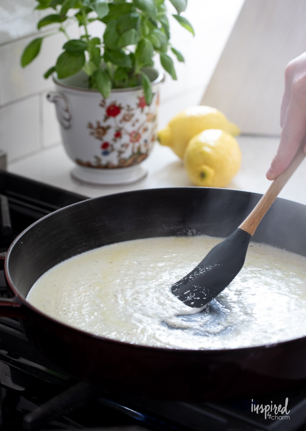 cooking lemon ricotta sauce in a pan.