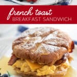 Pinterest image for French Toast Breakfast Sandwiches on plates with berries.