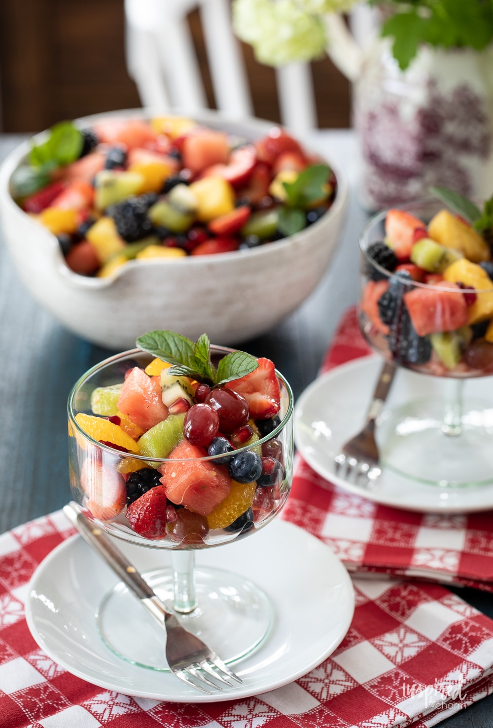 colorful fruit salad served in bowls and in a large bowl.