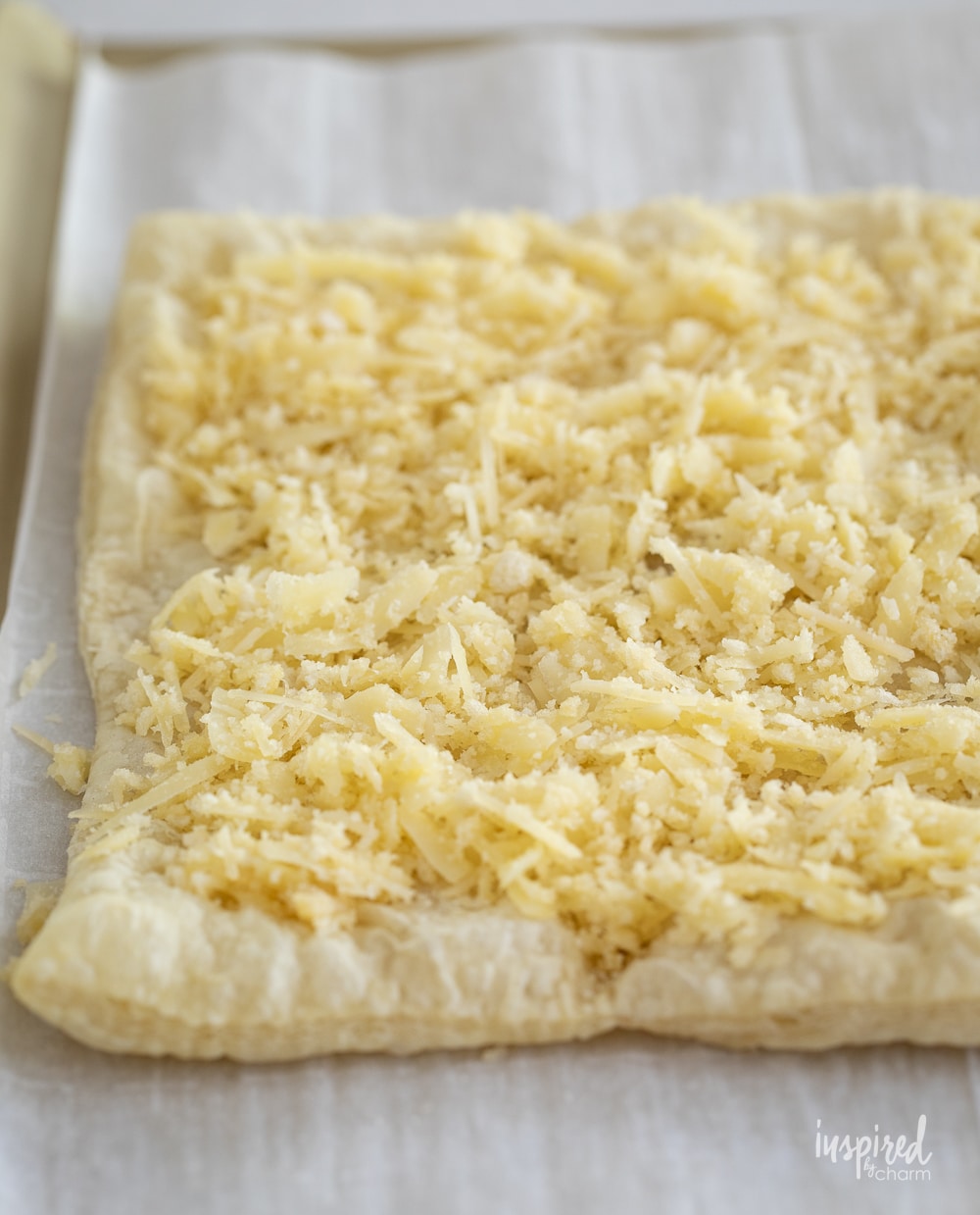 baked puff pastry sheet topped with cheese.