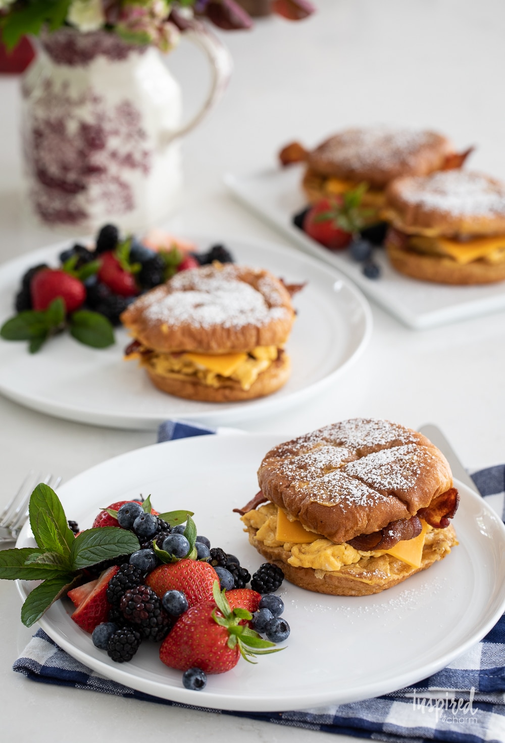 french toast breakfast sandwiches on plates served for breakfast.