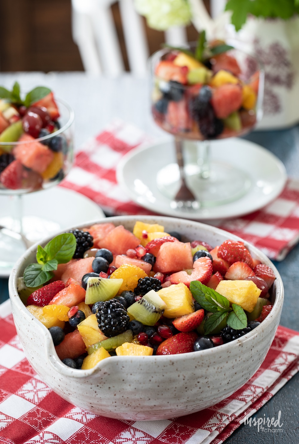 fruit salad served in a bowl with mint. 