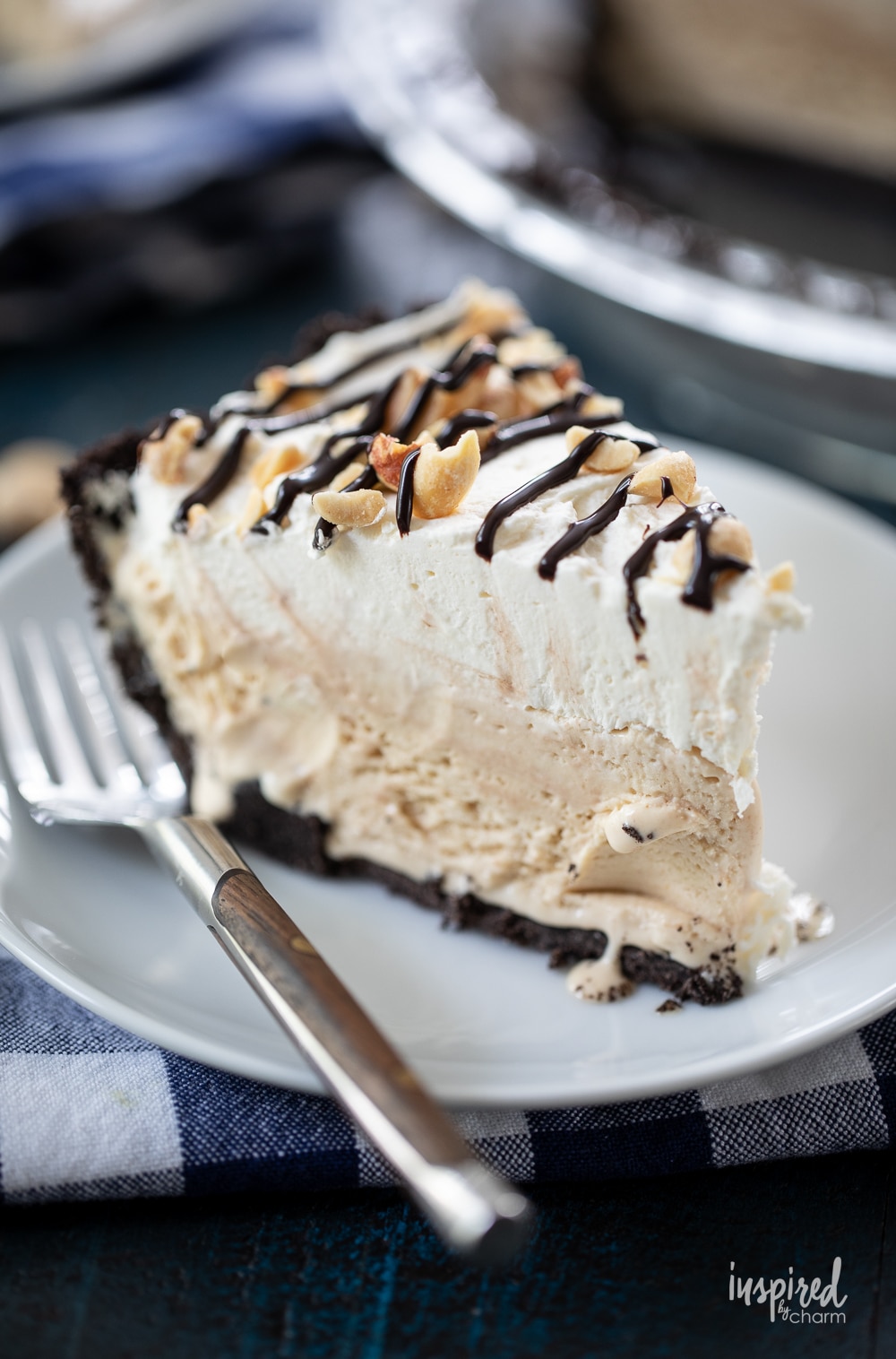 up close slice of peanut butter ice cream pie on a plate with a fork.