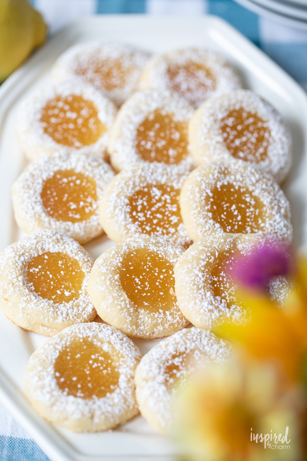 close up and overhead photo of lemon curd cookies on a platter.