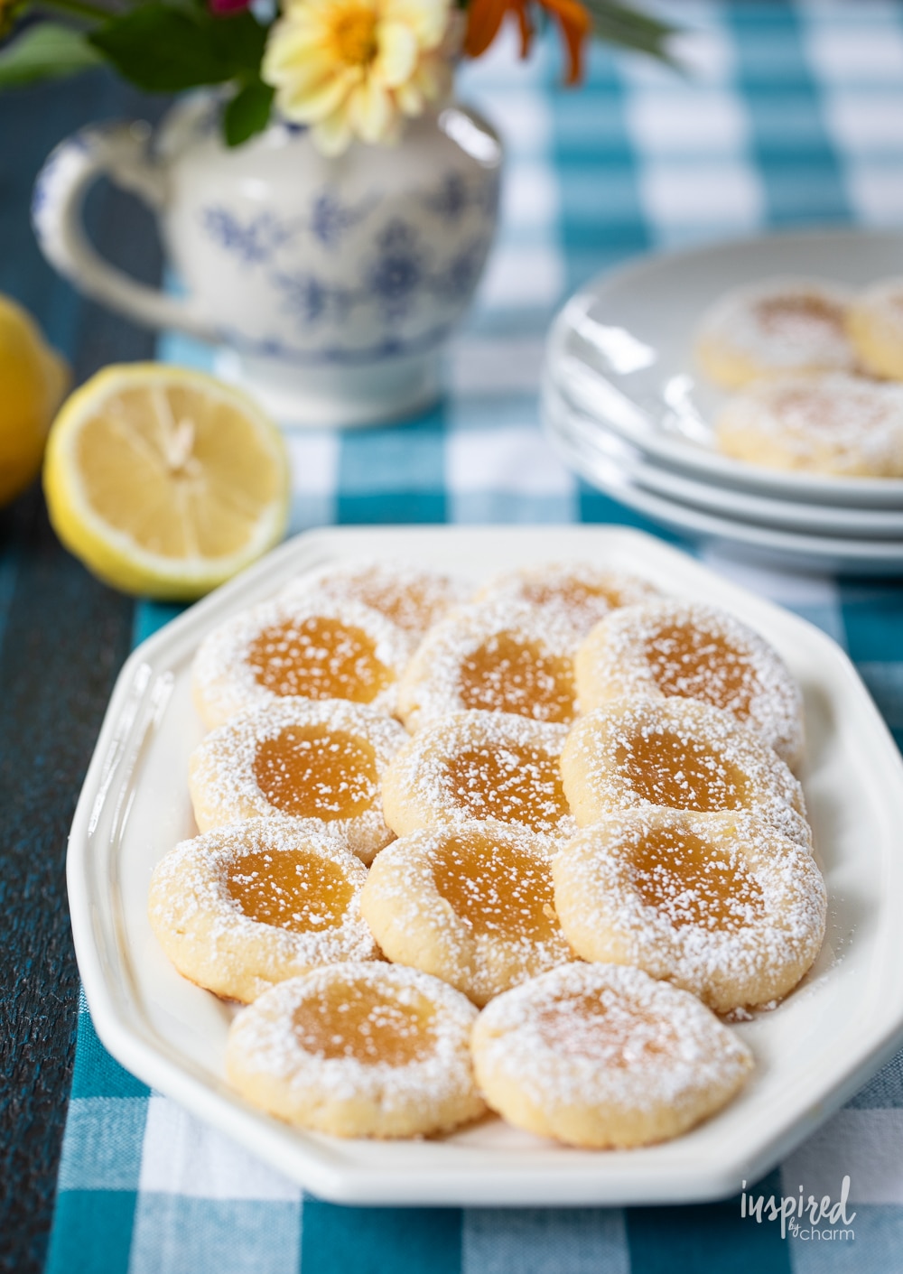 a batch of lemon curd cookies on a white plate.