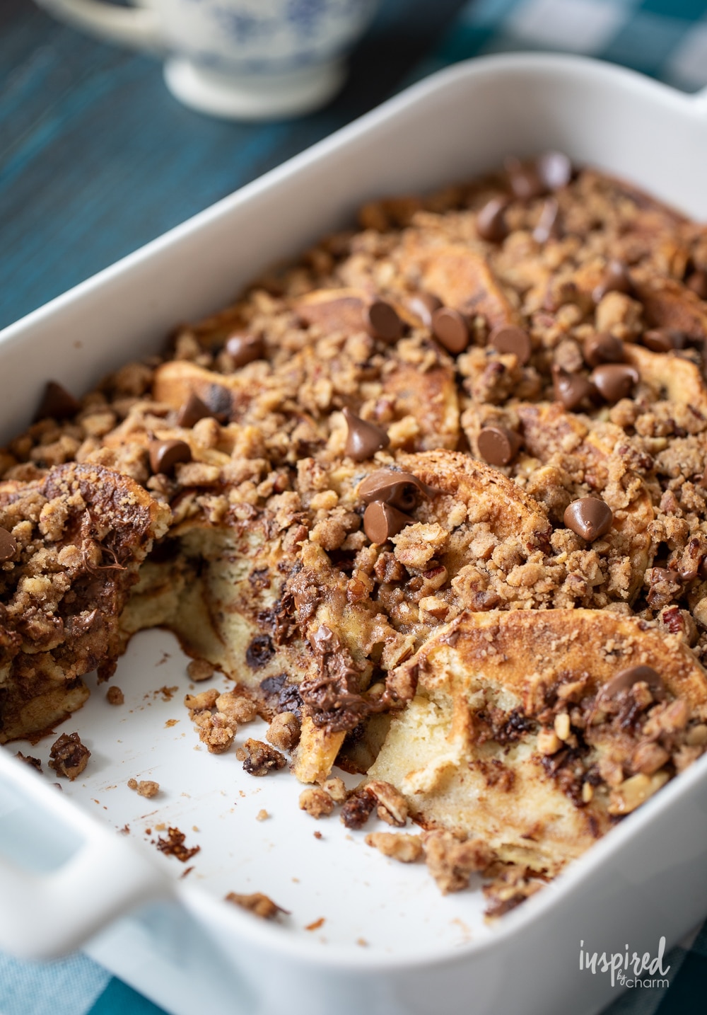 chocolate chip pancake casserole in a dish with pieces removed. 