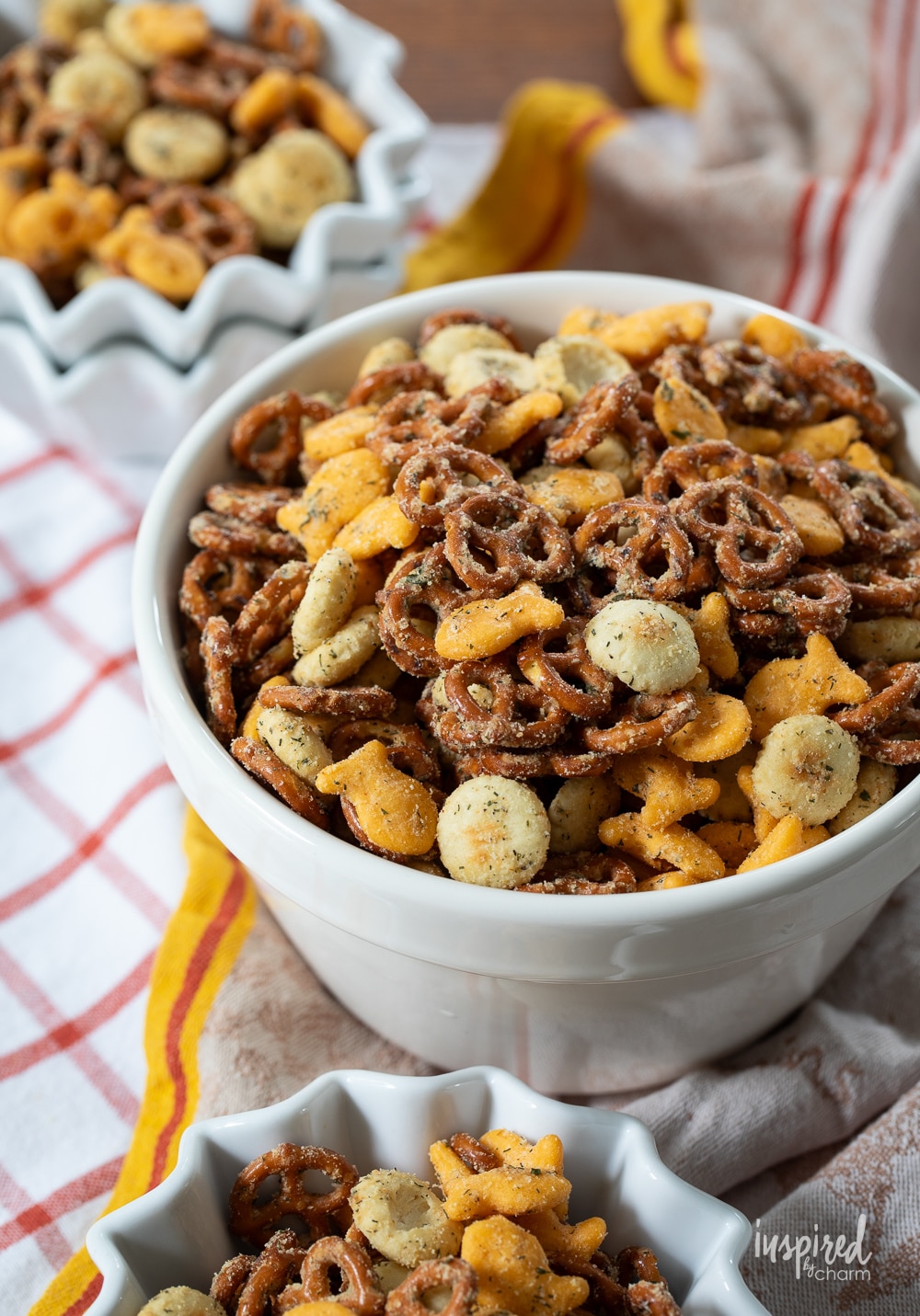 ranch pretzel snack mix in a large bowl and individual bowls.