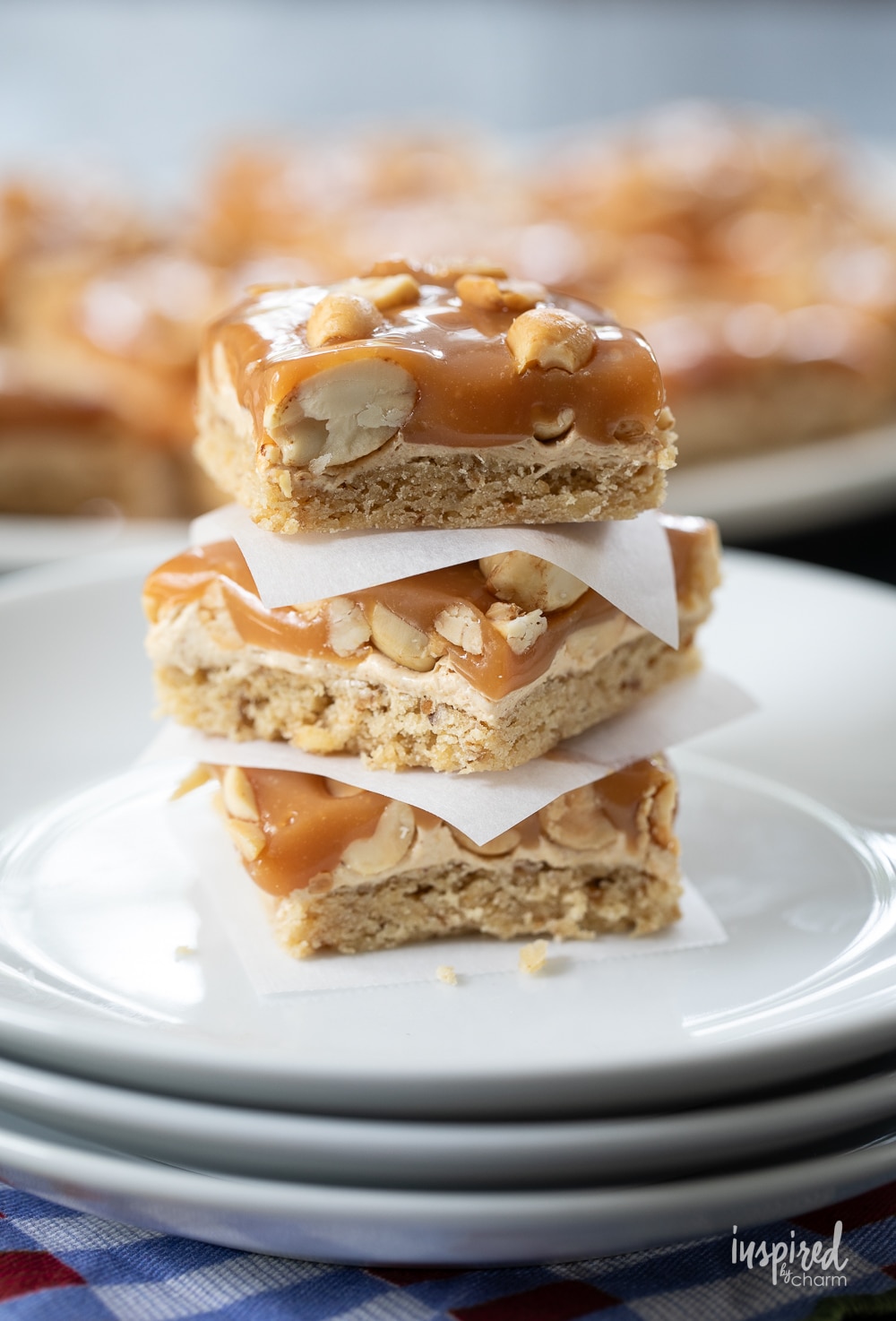 three salted peanut bars stacked on top of each other.