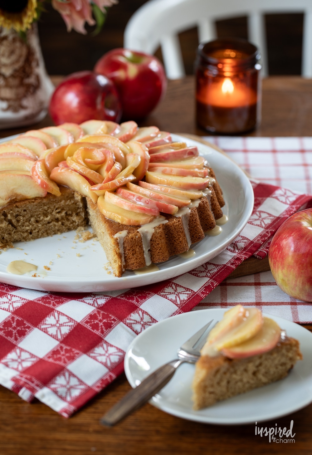 fresh apple cake sliced and served on a small plate.