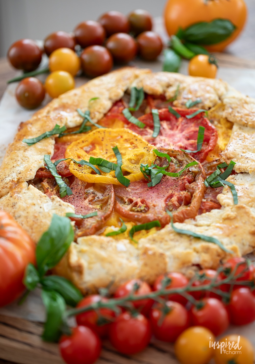 tomato galette topped with chopped basil.
